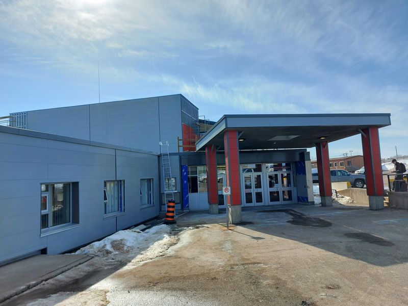 Main entrance canopy with red columns