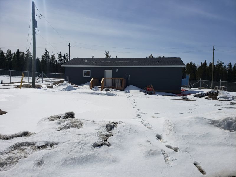 Staff accommodations building and yard